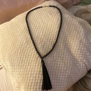 Long black necklace with tassel